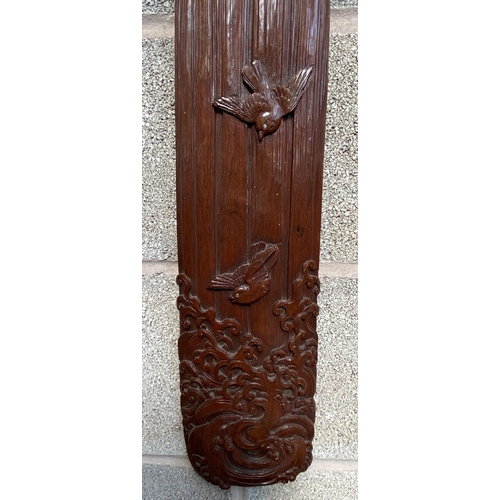 13 - A Chinese carved hardwood wall plaque with bird and foliate design - approx. 98cm high x 14cm wide