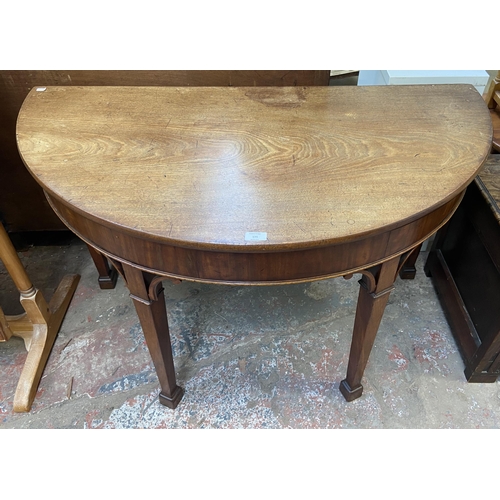 135 - A George III mahogany demi lune hall table - approx. 73cm high x 118cm wide x 60cm deep