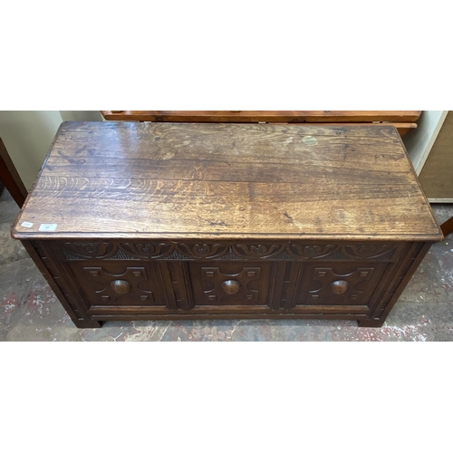 137 - A Georgian carved oak blanket box - approx. 52cm high x 107cm wide x 48cm deep