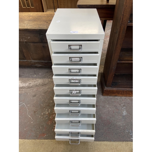 142 - A white metal ten drawer office filing cabinet - approx. 71cm high x 28cm wide x 40cm deep