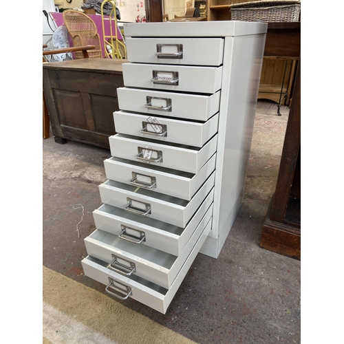 142 - A white metal ten drawer office filing cabinet - approx. 71cm high x 28cm wide x 40cm deep