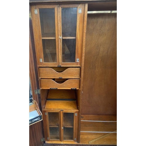 146 - A 1920s mahogany compactum double wardrobe with fitted interior - approx. 181cm high x 117cm wide x ... 