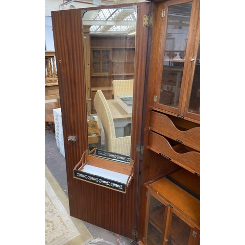 146 - A 1920s mahogany compactum double wardrobe with fitted interior - approx. 181cm high x 117cm wide x ... 