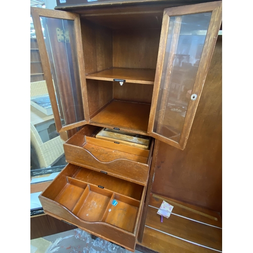 146 - A 1920s mahogany compactum double wardrobe with fitted interior - approx. 181cm high x 117cm wide x ... 