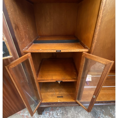 146 - A 1920s mahogany compactum double wardrobe with fitted interior - approx. 181cm high x 117cm wide x ... 