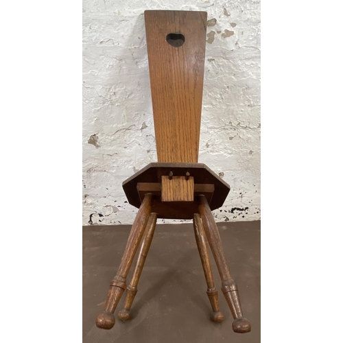 147 - A carved oak spinning chair - approx. 85cm high