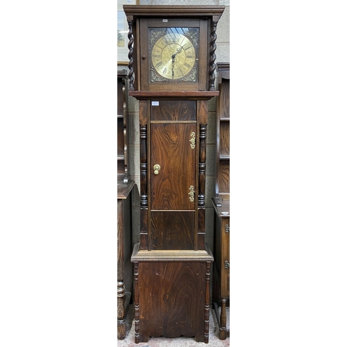 15 - A Georgian style oak cased grandfather clock with barley twist design, brass face and pendulum - app... 