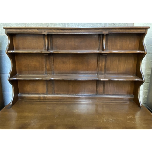 18 - An Ercol Old Colonial elm dresser - approx. 169cm high x 142cm wide x 50cm deep