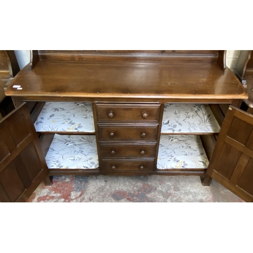 18 - An Ercol Old Colonial elm dresser - approx. 169cm high x 142cm wide x 50cm deep