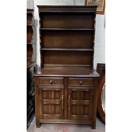 21 - A carved oak dresser - approx. 172cm high x 91cm wide x 41cm deep