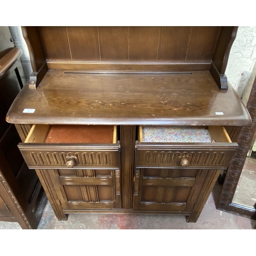 21 - A carved oak dresser - approx. 172cm high x 91cm wide x 41cm deep