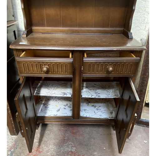 21 - A carved oak dresser - approx. 172cm high x 91cm wide x 41cm deep