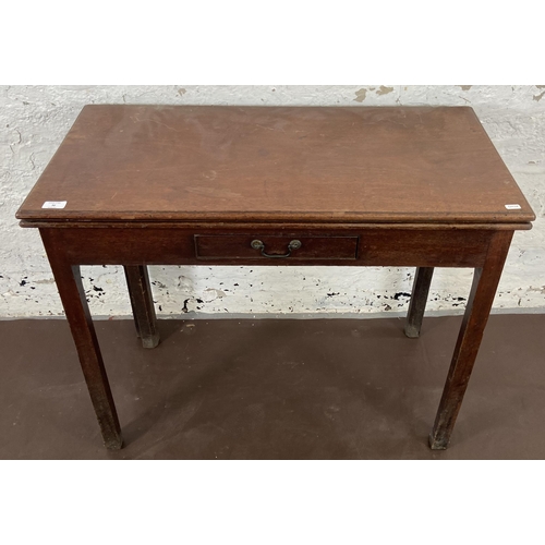 36 - A George III mahogany fold over tea table - approx. 74cm high x 90cm wide x 45cm deep