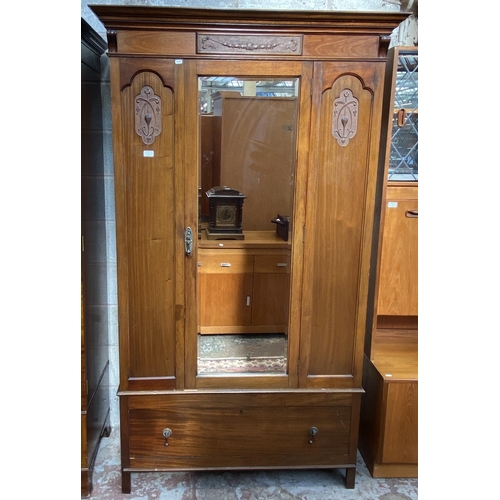 4 - An Edwardian carved mahogany mirror door wardrobe - approx. 205cm high x 119cm wide x 53cm deep