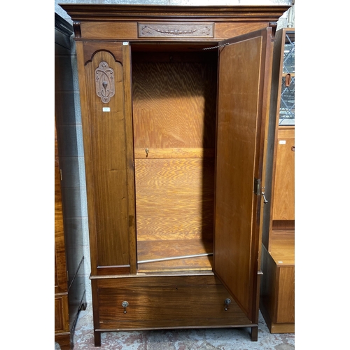 4 - An Edwardian carved mahogany mirror door wardrobe - approx. 205cm high x 119cm wide x 53cm deep