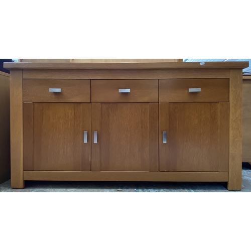 44 - A modern oak sideboard - approx. 80cm high x 150cm wide x 40cm deep