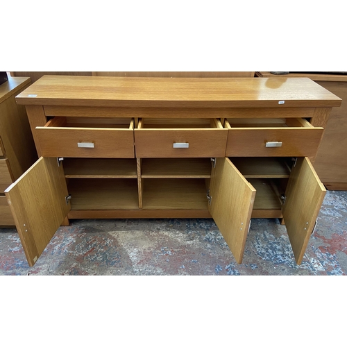 44 - A modern oak sideboard - approx. 80cm high x 150cm wide x 40cm deep