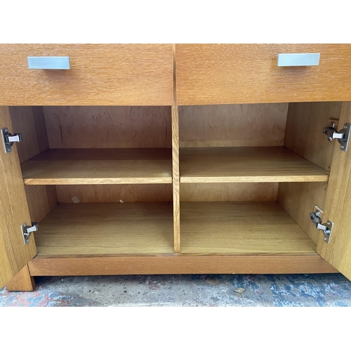 44 - A modern oak sideboard - approx. 80cm high x 150cm wide x 40cm deep