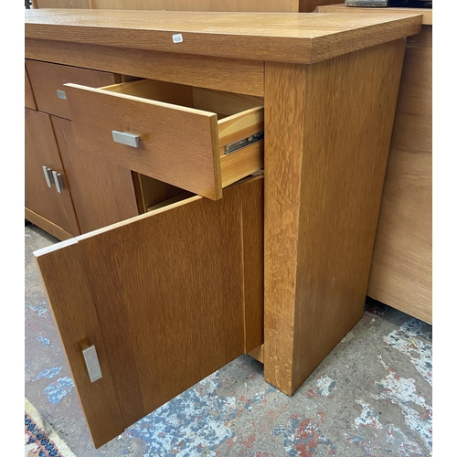 44 - A modern oak sideboard - approx. 80cm high x 150cm wide x 40cm deep