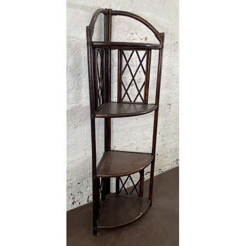 49 - A wicker and cane four tier corner shelving unit - approx. 151cm high