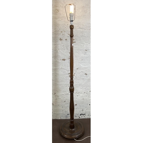 51 - A beech standard lamp with circular base - approx. 155cm high