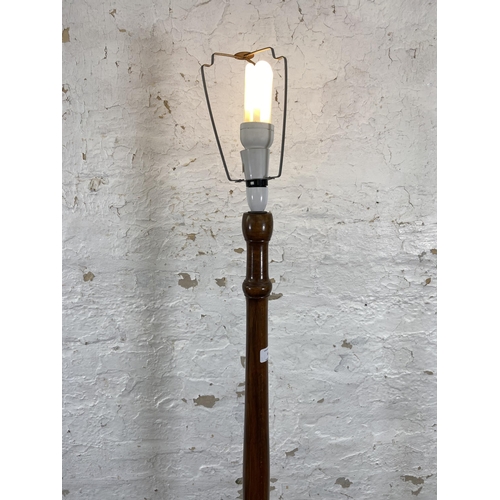 51 - A beech standard lamp with circular base - approx. 155cm high