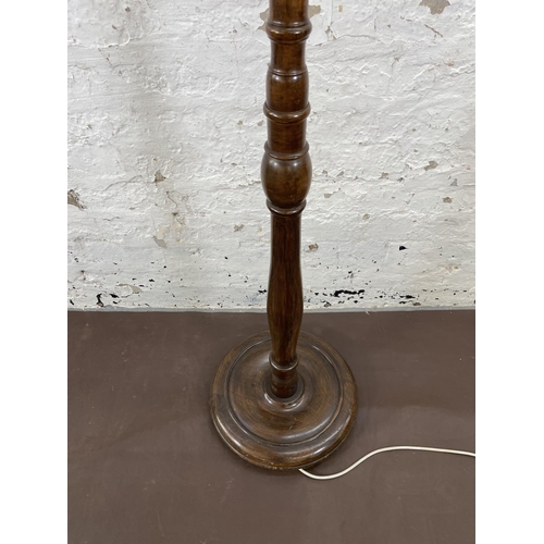 51 - A beech standard lamp with circular base - approx. 155cm high