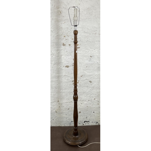 51 - A beech standard lamp with circular base - approx. 155cm high