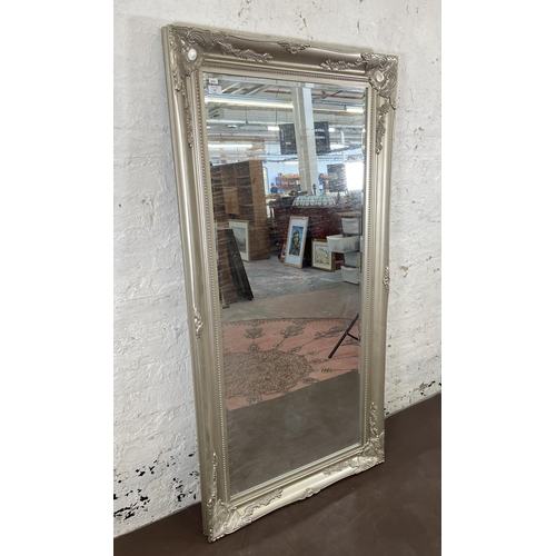 52 - A French style silver painted framed bevelled edge wall mirror - approx. 159cm x 78cm