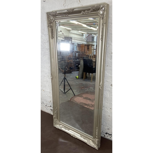 52 - A French style silver painted framed bevelled edge wall mirror - approx. 159cm x 78cm