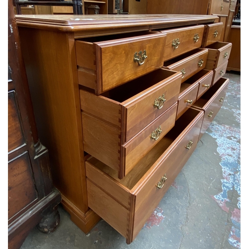 57 - A Younger cherry wood chest of drawers - approx. 81cm high x 143cm wide x 46cm deep