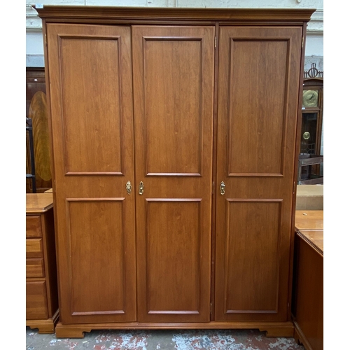 58 - A Younger cherry wood triple wardrobe - approx. 190cm high x 150cm wide x 60cm deep