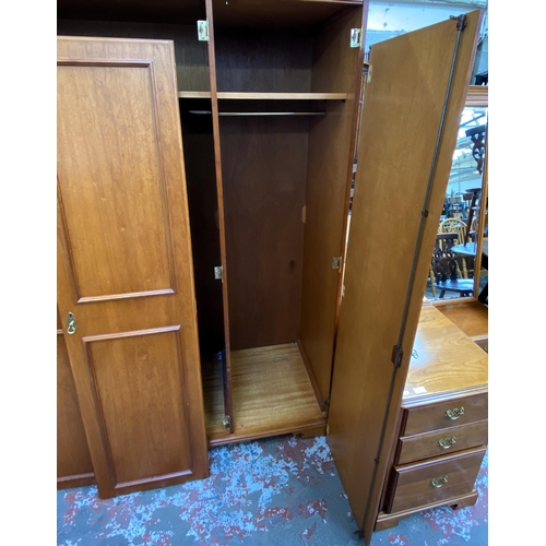 58 - A Younger cherry wood triple wardrobe - approx. 190cm high x 150cm wide x 60cm deep