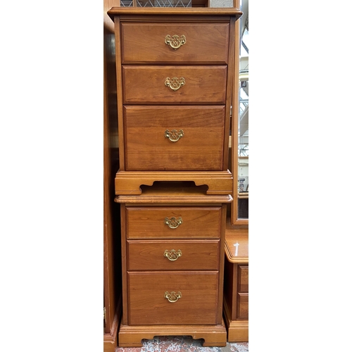 59 - A pair of Younger cherry wood bedside chests of drawers - approx. 68cm high x 47cm wide x 46cm deep