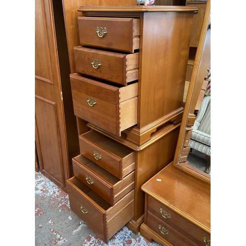 59 - A pair of Younger cherry wood bedside chests of drawers - approx. 68cm high x 47cm wide x 46cm deep