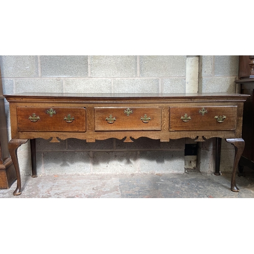 9 - A George III oak three drawer dresser base on cabriole supports - approx. 80cm high x 190cm wide x 4... 