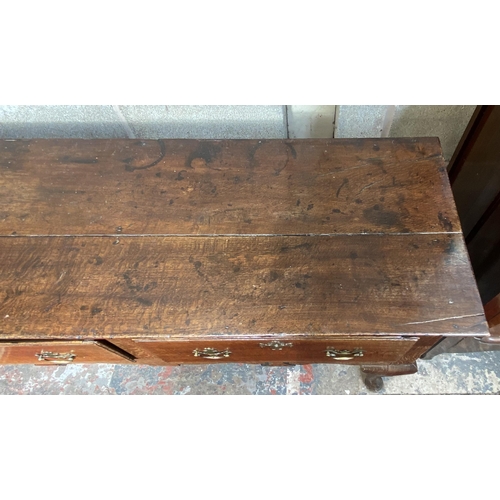 9 - A George III oak three drawer dresser base on cabriole supports - approx. 80cm high x 190cm wide x 4... 