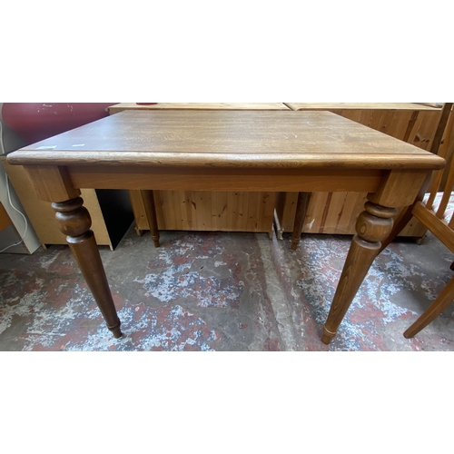 91 - A beech rectangular dining table and two chairs - approx. 74cm high x 65cm wide x 90cm long