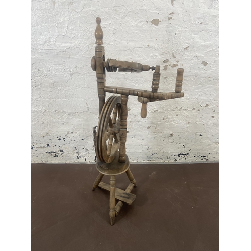 97 - A 19th century style beech spinning wheel - approx. 100cm high