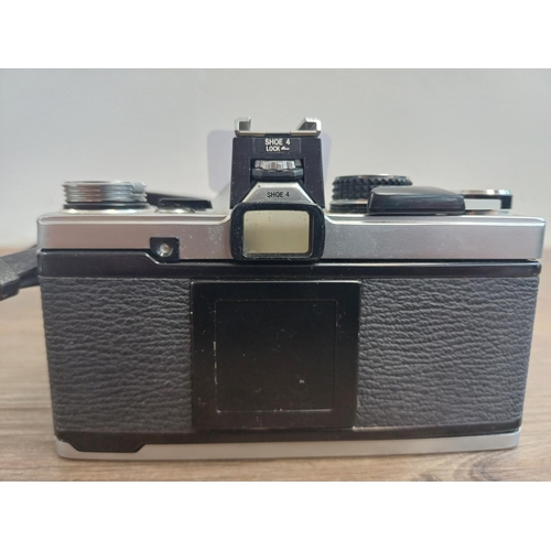 552 - An Olympus OM-2N 35mm SLR camera fitted with Zuiko MC 1:1.8 f=50mm auto-s lens