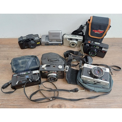 554 - Seven Ricoh compact cameras, one 500 ME 35mm rangefinder, one 35ZF 35mm viewfinder (A/F), one FF-3AF... 