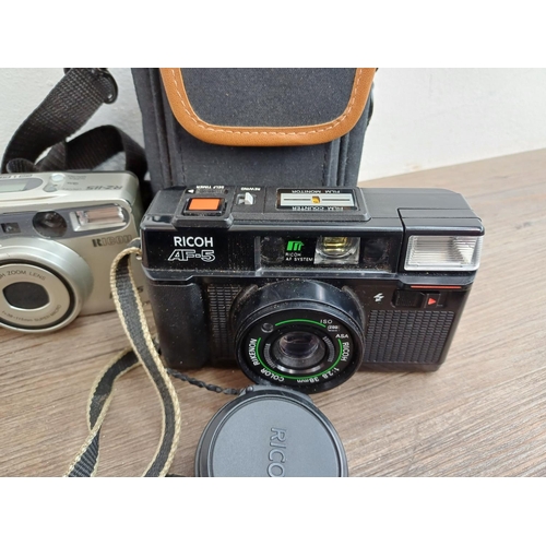 554 - Seven Ricoh compact cameras, one 500 ME 35mm rangefinder, one 35ZF 35mm viewfinder (A/F), one FF-3AF... 