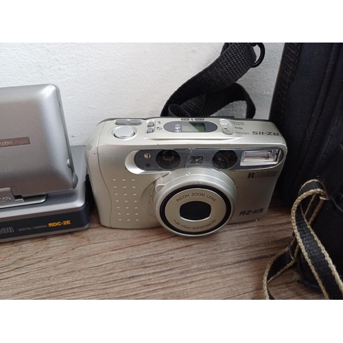 554 - Seven Ricoh compact cameras, one 500 ME 35mm rangefinder, one 35ZF 35mm viewfinder (A/F), one FF-3AF... 