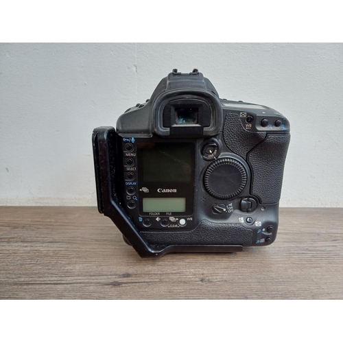 559 - A Canon EOS-1D Mark II 8mp professional DSLR camera body fitted with Really Right Stuff L-plate