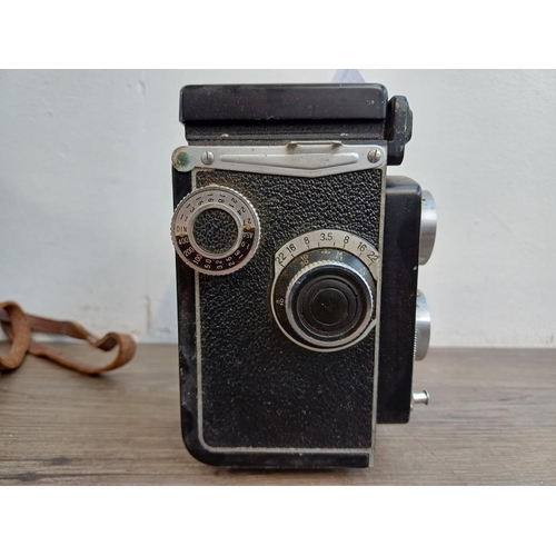 561 - A cased Yashica-A 6x6 TLR camera for 120 film fitted with Yashikor 1:3.5 f=80mm lenses and Copal shu... 