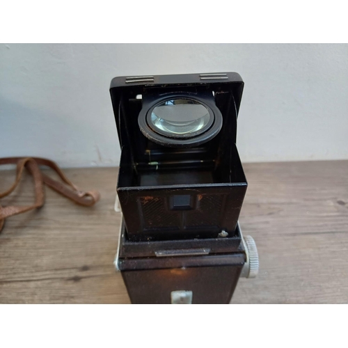 561 - A cased Yashica-A 6x6 TLR camera for 120 film fitted with Yashikor 1:3.5 f=80mm lenses and Copal shu... 