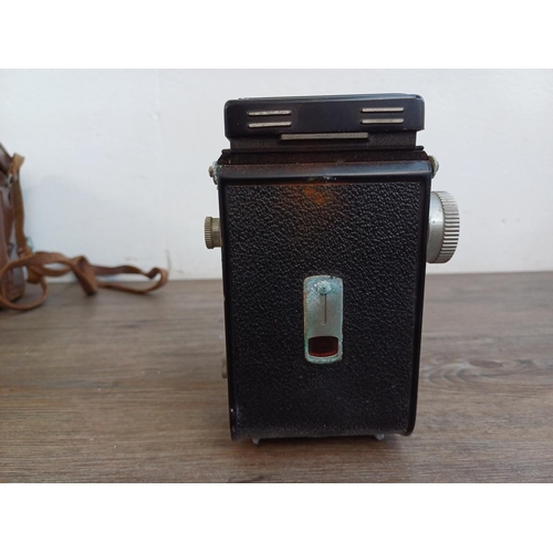 561 - A cased Yashica-A 6x6 TLR camera for 120 film fitted with Yashikor 1:3.5 f=80mm lenses and Copal shu... 