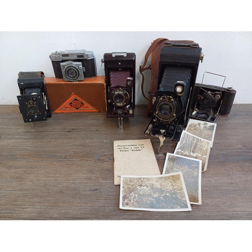 562 - Five folding cameras, one boxed Soho Cadet Bakelite cased 6x9 viewfinder for 120 film, one cased Kod... 