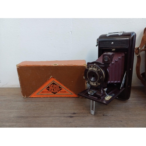 562 - Five folding cameras, one boxed Soho Cadet Bakelite cased 6x9 viewfinder for 120 film, one cased Kod... 