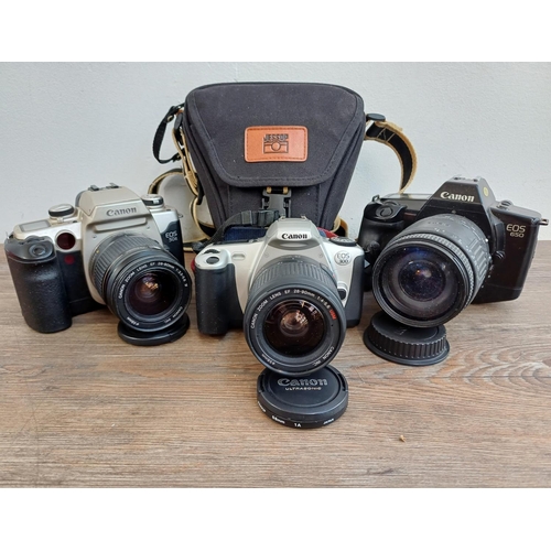 563 - Three Canon EOS 35mm SLR cameras, one 650 fitted with Sigma 28-200mm 1:3.8-5.6 zoom lens, one cased ... 